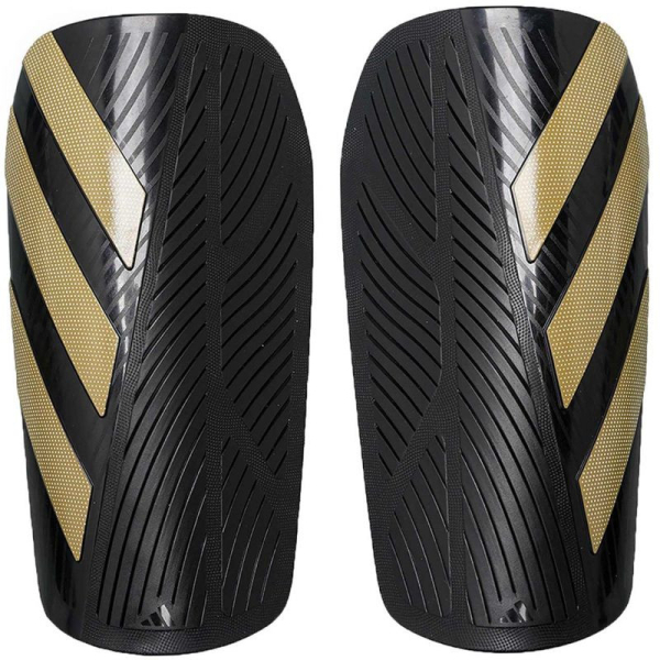 Adidas TIRO SG EU CLUB futbalový chránič, čierno-zlatá farba Adidas TIRO SG EU CLUB futbalový chránič, čierno-zlatá farba